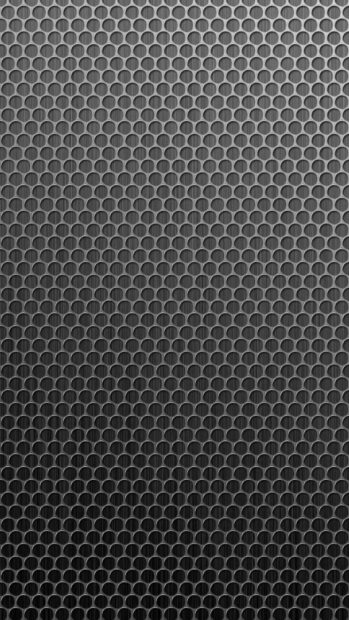 Close up of metal texture with circular hole pattern in high definition