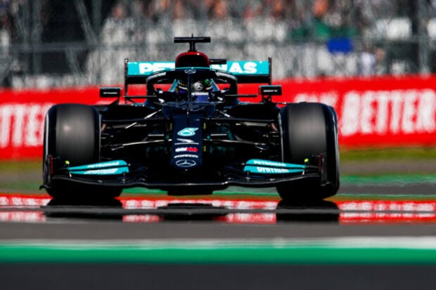 Formula One race car speeding on the racetrack with motorsports design