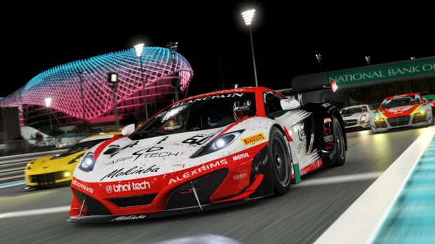 Racecars competing at night on a motorsports track with bright lights and modern architecture