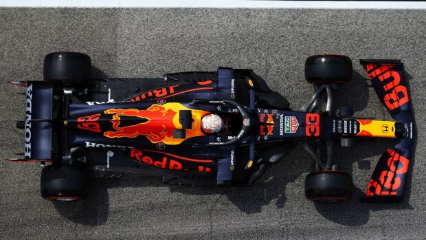 A Red Bull Honda Formula 1 car racing on asphalt with a detailed top view of the vehicle
