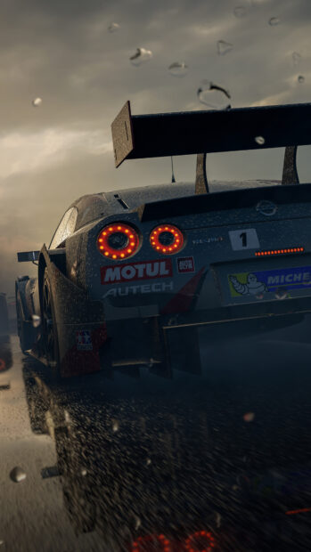 Nissan race car speeding on wet track with motorsports decals and rain droplets