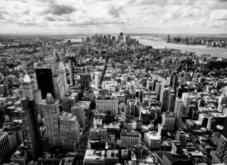 Aerial view of New York cityscape in black and white showing urban architecture