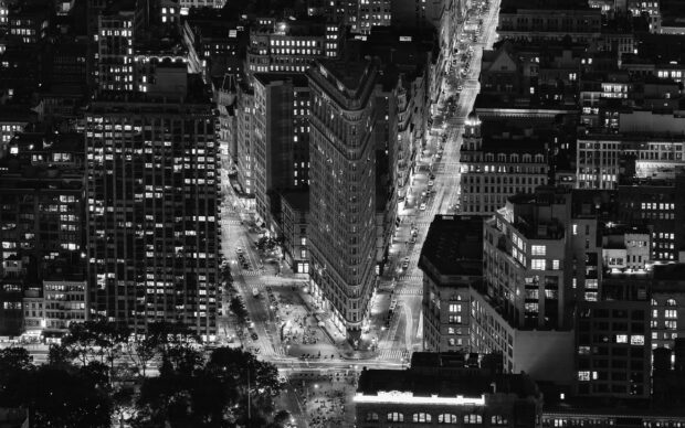 Iconic Flatiron building in New York City captured in black and white at night
