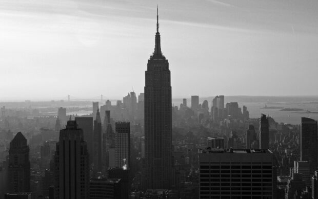 Empire State Building in New York city skyline captured in black and white
