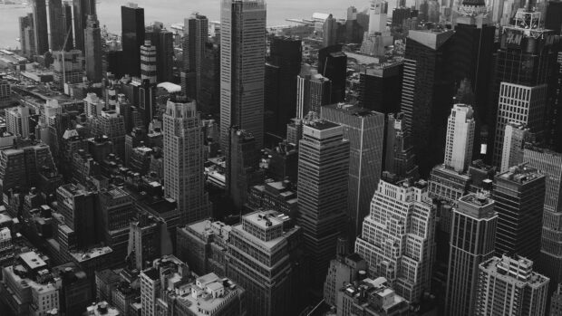 A detailed view of New York cityscape with tall buildings in black and white