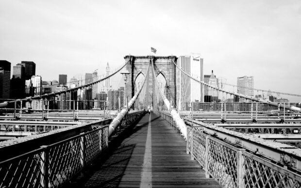 The Brooklyn Bridge in New York with city skyline in black and white tone