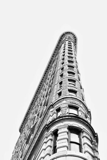 Historic New York architecture captured in black and white from a low angle