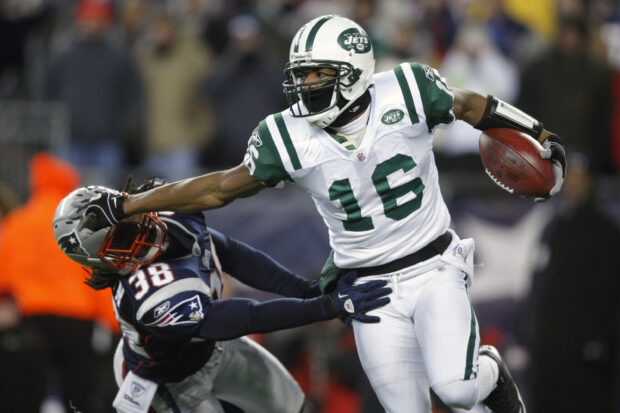 A New York Jets player evades a tackle during a football game against the Patriots