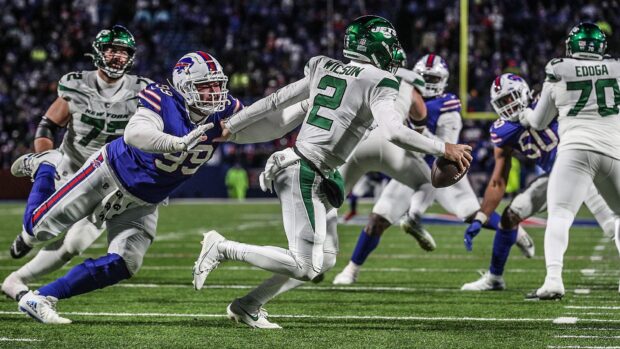 Wilson #2 escapes a tackle during an intense New York Jets game against the Bills