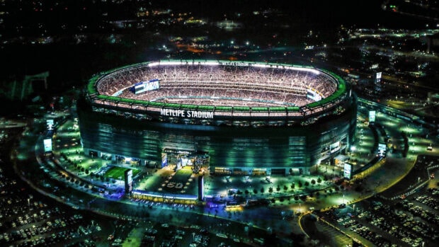 Metlife Stadium filled with fans at night showcasing New York Jets