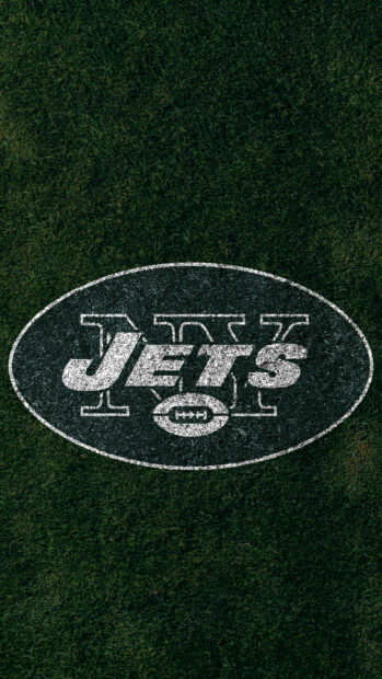 A green field with the New York Jets logo painted on the grass