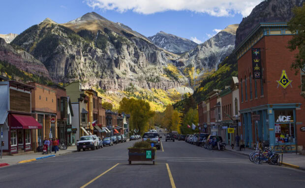 Small town street with mountain landscape in North America