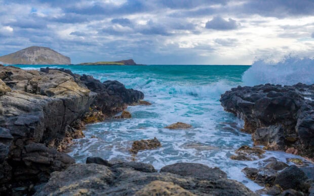 Rocky coastline with turquoise waters at Oahu coast