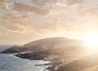 Winding coastal road in Oahu with ocean views at sunset