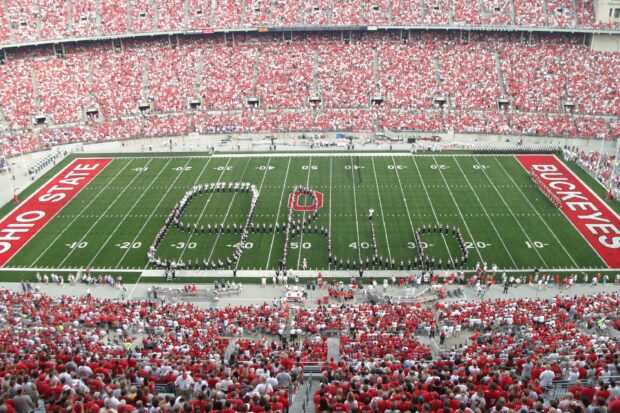 Ohio State University marching band forms the word Ohio on a football field during a game