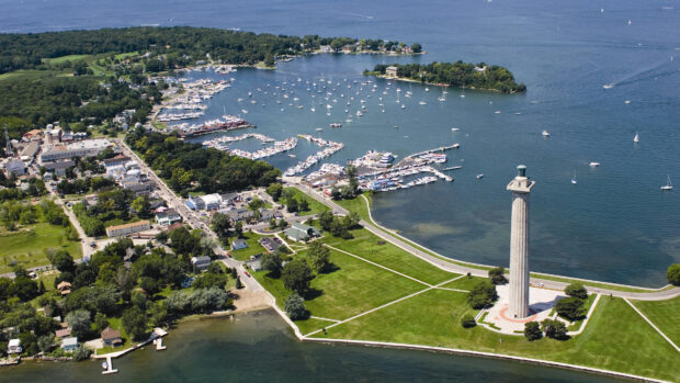 Aerial view of Ohio harbor with monument and boats on the water in a scenic landscape