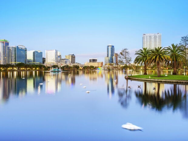 The Orlando skyline with high rise buildings and lake view during the evening light