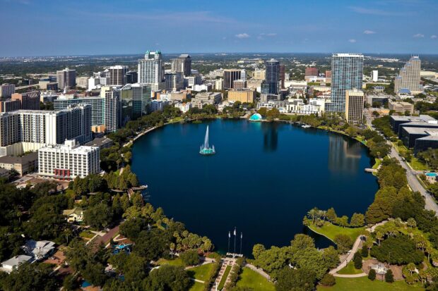 Aerial view of Orlando skyline featuring the cityscape and lake in clear daylight