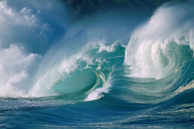 Powerful ocean wave crashing with foamy water in the Pacific Ocean
