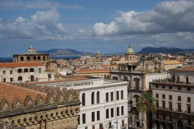 Historic architecture and cityscape of Palermo under a cloudy sky