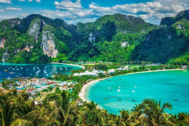 A scenic view of Phi Phi with lush green mountains and turquoise water bay