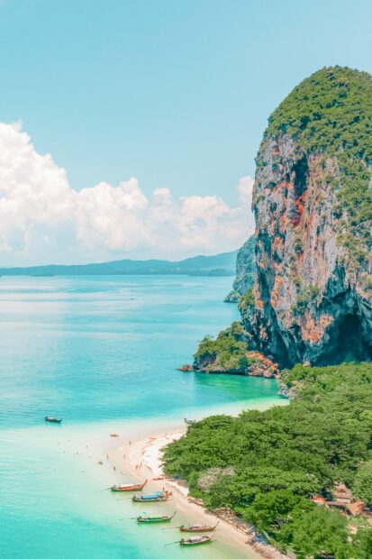 A beautiful tropical beach with turquoise water and lush greenery in Phi Phi