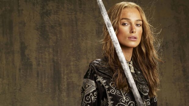 Female pirate holding a sword in Pirates of the Caribbean attire