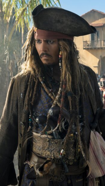 A close up of a pirate character from Pirates of the Caribbean with detailed costume and accessories
