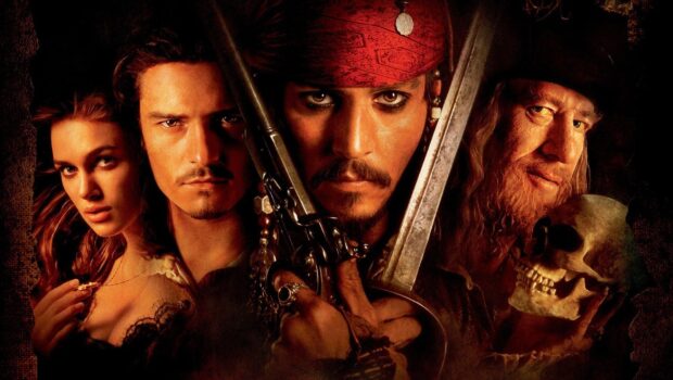 The Pirates of the Caribbean characters holding weapons and a skull in an intense scene