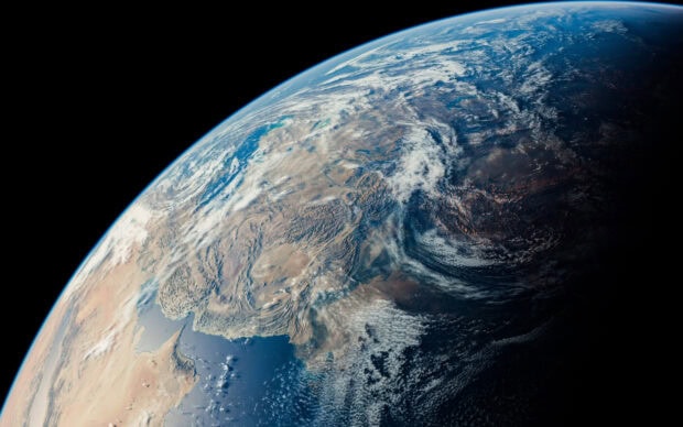 A detailed view of Planet Earth showing continents and cloud formations from space