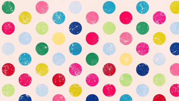 Colorful polka dot pattern with various shades on a light textured surface