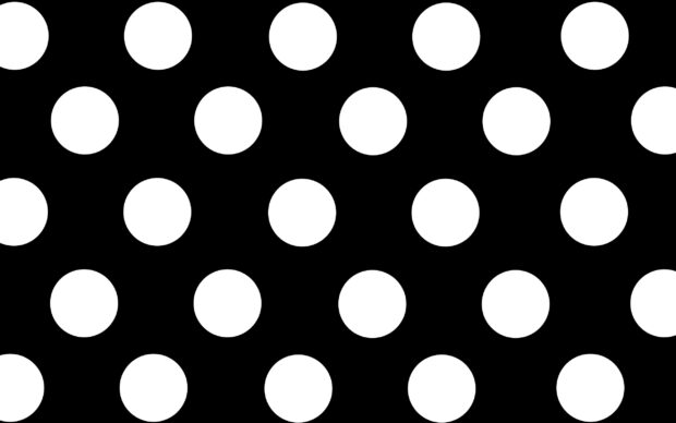 Large white polka dot pattern on black background with polka dot design