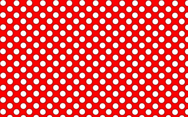 White polka dot pattern on a red surface with a regular design