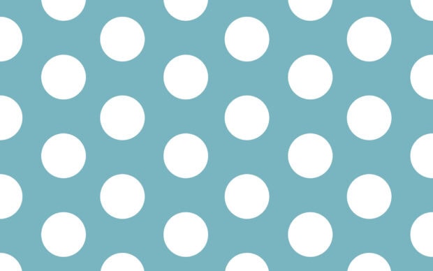 Blue pattern with white polka dot design on a desktop wallpaper