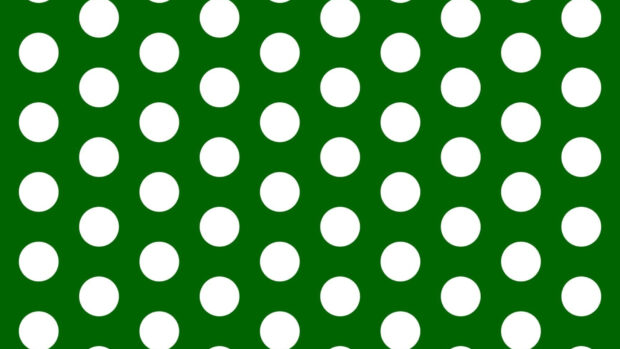 White polka dots pattern on a green background with a repeating design