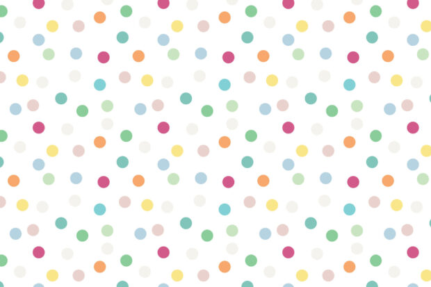 Colorful polka dot pattern in various sizes on a white background