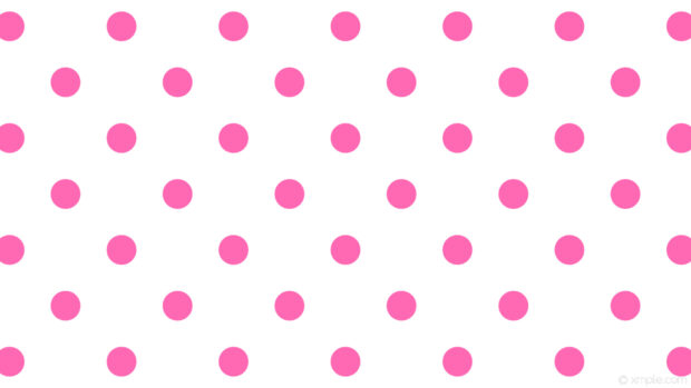 Pink polka dot pattern is seamless and bright on a white background