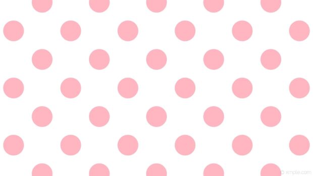 Pink polka dot pattern on a white surface featuring polka dot design