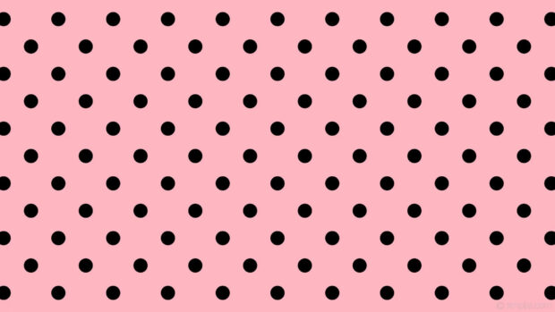 A seamless pattern of black polka dot on a pink polka dot design