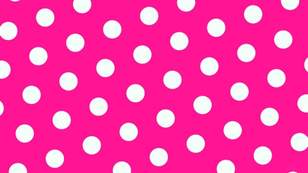 Bright pink polka dot pattern with white dots scattered evenly across the surface