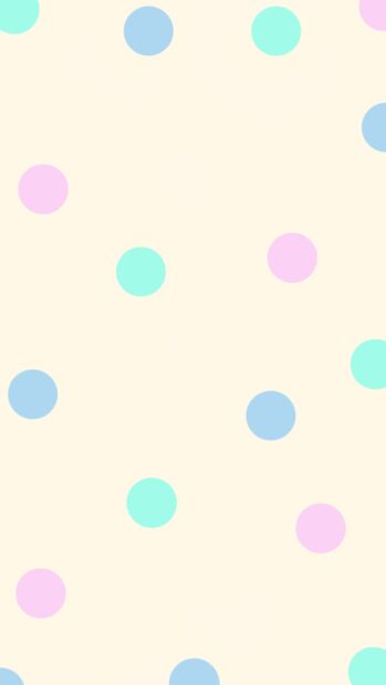 Pastel polka dot pattern with blue pink and green circles on a light background