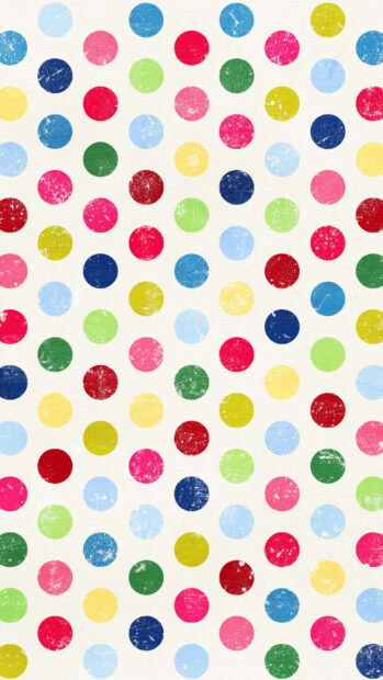 Colorful polka dot pattern with distressed texture on a white canvas background
