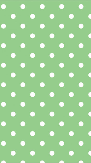 White polka dot pattern on a green background with polka dot design