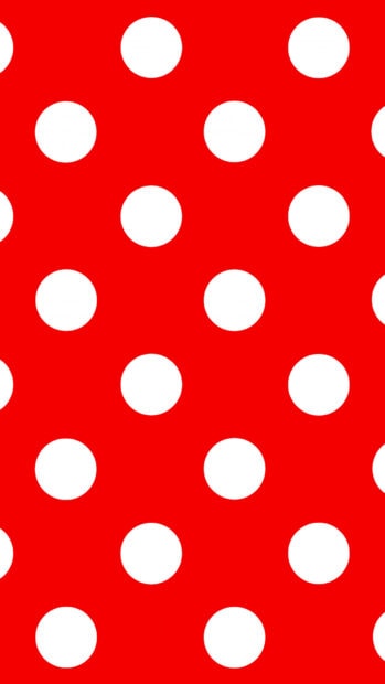 Red pattern with white polka dots creating a vibrant polka dot design