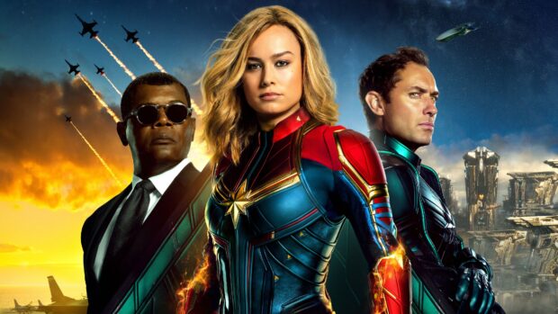 Captain Marvel poster with three heroes and fighter jets flying at sunset
