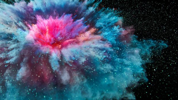 Vibrant powder explosion with bright pink and blue colors on black background