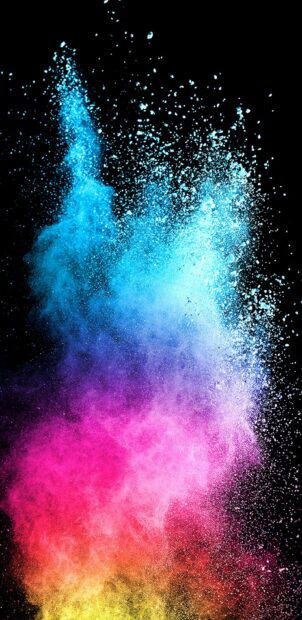 Vibrant colorful powder swirling in the air on a black background