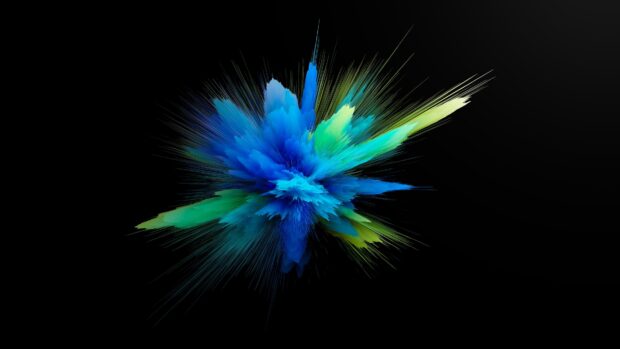 Blue and green powder explosion with dynamic streaks on a black background