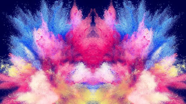 Vibrant colorful powder explosion with blue red pink and yellow hues