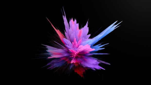 Vibrant explosion of pink purple and blue powder in abstract art form on black background